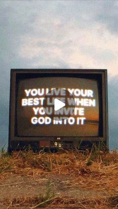 an old television with the words you live your best life when you write god into it