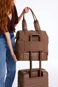 Introducing the mini to our OG weekender. This bag is the minimalists dream and is perfect for your personal item, an overnight trip, or even a weekend away. Take the stress out of packing with a wide easy access opening so you can see everything inside, a built-in padded laptop sleeve, and a separate bottom compartment (perfect for shoes). Ready to go? Simply slide our trolley passthrough pocket over your suitcase handles and you’re off! Perfect For: The ideal personal item, shaped to fit your Versatile Weekender Bag With Adjustable Strap For Overnight Trips, Versatile Travel Bag With Adjustable Strap, Versatile Duffle Bag With Adjustable Strap For Trips, Modern Gym Bag With Luggage Sleeve For Weekend Trips, Versatile Weekender Bag For Overnight Trips, Modern Travel Bag With Adjustable Strap For Weekend Trips, Versatile Travel Bag For Overnight Trips, Modern Travel Bag For Weekend Trips With Adjustable Strap, Modern Weekender Bag With Adjustable Strap For Overnight Trips