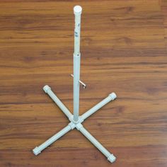 four white sticks are arranged on the floor