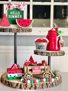 three tiered trays with various items on top of each other, including watermelon