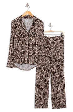 A soft jersey knit pajama set with a pretty print delivers feminine style and essential comfort. 2-piece set Shirt: 25" length (size S); Pants: 9.5" rise, 32" inseam (size S) Shirt: notch lapel, long sleeves, front button closures, chest patch pocket, allover print, contrast piping, knit construction Pants: elasticized waist, pull-on style, allover print, knit construction 95% rayon, 5% spandex Machine wash cold Imported Model’s stats for sizing: 5’11” height, 32” bust, 24” waist, 34” hips. Mode Long Sleeve Sleepwear Matching Set For Lounging, Long Sleeve Matching Set Sleepwear For Lounging, Printed Sets With Relaxed Fit For Lounging, Casual Printed Long Sleeve Sleepwear, Casual Long Sleeve Printed Sleepwear, Cozy Fitted Loungewear Sets, Long Sleeve Printed Loungewear Sets, Long Sleeve Printed Lounging Sets, Printed Long Sleeve Lounging Sets