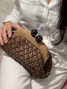 Crochet Bags With Wooden Handles, Chic Brown Crochet Bag With Leather Handles, Chic Knitted Shoulder Bag, Chic Brown Crochet Bag With Braided Handles, Chic Handwoven Handheld Crochet Bag, Brown Pouch Clutch With Braided Handles, Brown Clutch With Braided Handles For Everyday Use, Brown Leather Clutch With Braided Handles For Daily Use, Elegant Knitted Shoulder Bag For Everyday Use