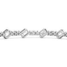 Designed with transitional appeal, this tennis bracelet elegantly combines rounded edges with crisp and clean lines. It features bezel-set emerald-cut diamonds set on stations along a series of claw-prong-set round diamonds. The two diamond cuts brilliantly work together, sparkling simultaneously. Claw Prong, Floral Pendant, Emerald Cut Diamonds, Gold Platinum, Tennis Bracelet, Three Stone, Lab Diamonds, Bezel Setting, Custom Rings