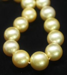 Hakimoto By Jewel Of Ocean 18K Natural Golden Color South Sea Pearl Strand Necklace 18K White Gold 1.75 Carts Diamonds Clasp Weight (g): 124 Cultured Natural Color Golden South Sea Pearl Pearl Size: 13X16.8mm Pearl Shape: Round Body color: Golden Orient: Very Good Luster: Very Good Surface: Clean Nacre: Very Good Matching: Very Good Maker: Jewel Of Ocean Estimated Manufactures Retail Price: $ 100,000 Excellent Condition Chain Length 18" Designer: Hakimoto All gemstone weights and measurements ar Hallmarked Yellow Gold Pearl Necklace For Anniversary, Exquisite Yellow Gold Round Pearl Necklace, Yellow Gold High Luster Pearl Necklace For Wedding, Gold Pearl Necklace For Formal Occasions, Classic Gold Pearl Necklace For Formal Occasions, Yellow Gold High Luster Round Beads Necklace, Gold Pearl Necklace With High Luster, Gold High Luster Pearl Necklace In Fine Jewelry Style, Yellow Gold Necklace With High Luster Round Beads