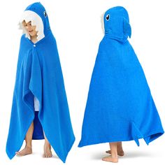 two children's hooded towels with shark faces on them, one in blue and the other in white