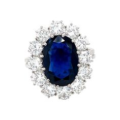 This 18K white gold refine ring is from our Timeless Collection. It is made of a 4.80 Carat gorgeous siam blue sapphire decorated by 12 round shape natural white diamonds in total of 2.48 Carat. Total metal weight is 6.5 gr. Extraordinary piece for any occasion and over the generations ! The Timeless Collection is from the passion and love of Maison Vitale, inspired by the endless elegance and sophistication of classic high-jewelry, eternizing its beauty and presenting a selection of classy desi Luxury Sapphire Cluster Ring With Brilliant Cut, Formal Sapphire Diamond Ring In Platinum, Formal Vvs Clarity Cluster Sapphire Ring, Formal Cluster Sapphire Ring With Vvs Clarity, Luxury Cluster Sapphire Ring Gia Certified, Luxury Gia Certified Cluster Sapphire Ring, Luxury Lab-created Sapphire Ring For Formal Occasions, Exquisite Diamond Cut Sapphire Ring, Formal Sapphire Ring With Diamond