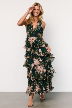 Jesslyn Open Back Tiered Maxi Dress | Green + Pink Green Maxi Halter Dress For Date Night, Halter Neck Floral Print Dress For Party, Summer Party Floral Halter Neck Dress, Green Tiered Maxi Dress For Party, Spring Green Backless Dress, Green Tie Back Maxi Dress For Garden Party, Spring V-neck Halter Dress For Garden Party, Ruffled Dresses For Vacation Garden Party, Floral Print Maxi Halter Dress For Party