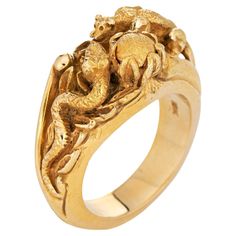 Finely detailed panther & snake ring crafted in 18 karat yellow gold. The elaborate and beautifully detailed ring highlights a panther perched in a predatory position to steal the eggs from the snake's nest. The coiled snake sits in a protective pose by the nest. The lifelike and intricate relief detail of the ring suggest that it was custom made (though the ring does not bear a designer or artisan signature). It's a true work of art. The ring is heavy at 37 grams and has a very weighty feel on Ball Python Ring, Safari Wedding, Coiled Snake, Best Engagement Rings, Detailed Ring, Snake Ring, Ring Crafts, Ring Vintage, Men's Jewelry