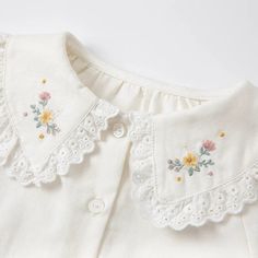 Baby Girls Embroidery Shirts Spring Fashion Elevate your little one's spring style with our adorable Baby Girls Embroidery Shirts. Crafted with love and attention to detail, these shirts are perfect for your fashion-forward baby girl. The delicate embroidery adds a charming touch, making her stand out in any gathering. Made from soft and breathable materials, our baby shirts ensure comfort throughout the day, allowing your baby to move freely while staying stylish. Whether it's a family picnic o Cute Spring Blouse With Peter Pan Collar, Spring Blouse With Cute Collar, Embroidered Cotton Collar Tops, Embroidered Doll Collar Top For Spring, Embroidered Tops With Doll Collar For Spring, Spring Embroidered Tops With Doll Collar, Sweet Long Sleeve Blouse For Spring, White Long Sleeve Shirt With Machine Embroidery, White Blouse With Floral Embroidery And Doll Collar