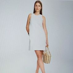 Size:00 Chic Cotton Sleeveless Dress Lined, Chic Sleeveless Cotton Dress Lined, Elegant Sleeveless Denim Dress For Summer, Elegant Sleeveless Summer Denim Dress, Spring Sleeveless Denim Dress For Work, Chic Denim Dress, Chic Daytime Lined Dresses, Elegant Summer Denim Dress For Workwear, Chic Sleeveless Denim Dress For Day Out