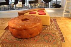 an ottoman and foot stool are on the floor