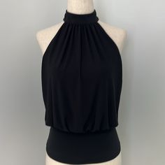 Dressy Tank. Halter Neck With Cut Out Back. Black. Nwt! Solid Color Sleeveless Top For Evening, Solid Color Sleeveless Halter Top For Date Night, Sleeveless Halter Top For Date Night, Solid Halter Neck Top For Night Out, Stretch Sleeveless Tops For Date Night, Black Sleeveless Halter Top For Date Night, Elegant Tank Halter Top For Night Out, Elegant Halter Tank Top For Night Out, Chic Black Sleeveless Halter Top