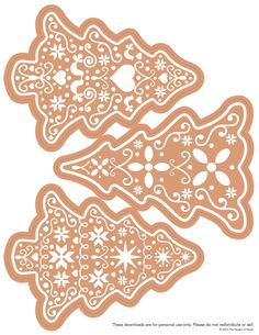 three gingerbread cookies cut out into shapes with snowflakes on the top and bottom