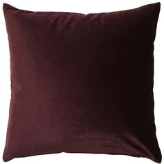 a dark purple pillow on a white background