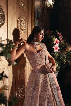 Designer Pakistani Bridal Dress in Pink Lehenga and Choli Style has a perfect balance of style and elegance. This stunning Bridal Lehenga Choli is a trendy masterpiece adorned with Embroidery and hand-crafted details of embellishments, making it an epitome of beauty and grace. Lavender Bridal Lehenga, Choli Style, Bridal Lehenga Pakistani, Modern Lehenga, Pakistani Bridal Lehenga, Wedding Dresses Pakistani, Bridal Mehndi Dresses, Pakistani Bridal Dress, Walima Dress