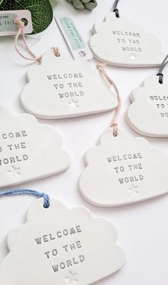 white ceramic welcome to the world ornament