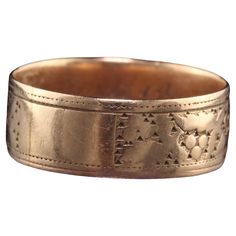 Beautiful Antique Victorian 14K Rose Gold Engraved Wide Wedding Band. This beautiful wedding band is crafted in 14K rose gold and has an interesting engraved design going around the entire ring. Item #R1190 Metal: 14K Rose Gold Weight: 2.5 Grams Size: 6 3/4 Measurements: Top of the ring measures 6.53 mm wide and band measures 6.53 mm wide. Measurements off the finger: .68 mm high Layaway: For your convenience, we will be happy to provide layaway payment options. Please contact us to work out a l Luxury Vintage Engraved Ceremonial Ring, Luxury Victorian Yellow Gold Engraved Ring, Victorian Wedding Ring 1stdibs, Rose Gold 14k Decorative Wedding Band, Heirloom Rose Gold 14k Band, Ceremonial Yellow Gold Wedding Band With Decorative Details, Rose Gold Decorative Band For Anniversary, Rose Gold Decorative Bands For Anniversary, Rose Gold Decorative Band