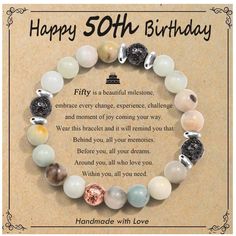 a birthday card with an image of a bracelet made out of glass beads and the words, happy 50th