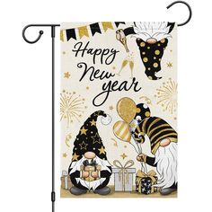 a happy new year garden flag with two gnomes holding gifts and fireworks in the background