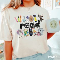 Read Children Books Shirt, Teacher Read Shirt, Kindergarten Gift Shirt,Comfort Colors,Read Kids Shirt,  Book Lover Shirt,Funny Kids Tee 1747 COMFORT COLORS - ADULT UNISEX - SHORT SLEEVE T-SHIRT - 1717 6.1 oz./yd² (US), 10 oz/L yd (CA), 100% ring-spun cotton, 30 singles Garment dyed for that lived in feel and almost no shrinkage at home. Soft ring-spun cotton fabric with 100% cotton threads Relaxed fit Topstitched, classic width, rib collar Shoulder to shoulder twill tape Signature twill label Ma Daycare Teacher Shirts Designs, Casual School Shirt With Character Print, Funny Character Print T-shirt For School, Fun School Tops With Funny Text, Fun Relaxed Fit Shirt With Cartoon Print, Fun Cartoon Print Shirt With Relaxed Fit, Fun School Shirt With Funny Text, School T-shirt With Funny Print, Fun Relaxed Fit Shirt With Character Print