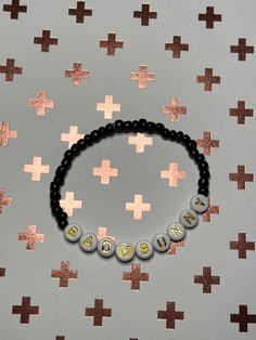 Bad bunny inspired bracelet.  Gold letters with black beads.  Can be customized to any size Bad Bunny Bracelet, Bunny Bracelet, Diy Bracelet Designs, Bad Bunny, Gold Letters, Diy Bracelet, Bracelet Gold, Black Beads, Bracelet Designs