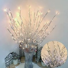 a vase filled with lots of white lights on top of a table next to a mirror