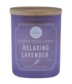 a candle that is sitting on top of a white surface with the words relaxing lavender in it