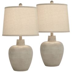 two white ceramic table lamps with beige shades