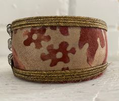 a close up of a bracelet on a table