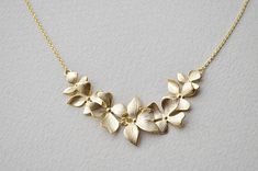 Beautiful Orchid flower necklace. ▶ Material - Gold or Rhodium plated over brass ▶ Chain Length - Adjustable (please choose it from option) ▶ Pendant measure - Flower H. 70mm x 22mm ▶ The matching earrings available https://www.etsy.com/listing/192494471/orchid-flower-drop-earrings-in-gold https://www.etsy.com/listing/190937422/orchid-flower-earrings-in-gold-gold ▶ The jewelry comes in a gift box ** Please check the shop policy for shipping information and jewelry care https://www.etsy.com/shop/ Flower Pendant Necklace For Wedding And Mother's Day, Minimalist Flower Necklace For Weddings, Wedding Flower Pendant Necklace For Mother's Day, Mother's Day Wedding Flower Pendant Necklace, Dainty Flower Pendant Necklace For Wedding, Minimalist Flower Pendant Necklace For Wedding, Delicate Flower Necklace For Wedding, Wedding Necklace With Delicate Flower Chain, Handmade Flower Necklace For Wedding And Mother's Day