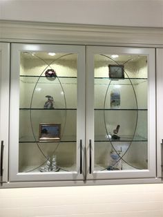 two glass doors with pictures on them in a room