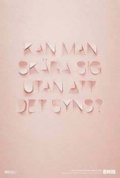 the words are made out of paper and placed on a pink surface with white lettering