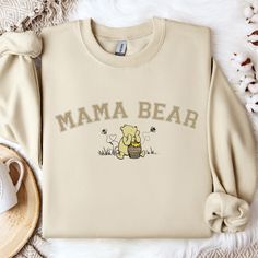 Introducing our Mama Pooh Bear Sweatshirt.  Crafted with premium cotton blend, this cozy sweatshirt not only offers warmth but also makes a bold statement. Elevate your style while spreading a powerful message with this unique and meaningful piece. The collar is ribbed knit, so it retains its shape even after washing. There are no itchy side seams on these sweatershirts. Nice for chilly evenings and colder days, this sweatshirt will be a staple all season. For oversized style/look - please size Gifts For New Grandma First Time, Mama Bear Sweatshirt, Mamma Bear, Fun Baby Announcement, Bear Sweatshirt, Unisex Baby Shower, Vintage Winnie The Pooh, Mom Baby, Mama Sweatshirt