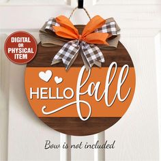 a wooden sign that says hello fall on the front door with an orange bow hanging from it