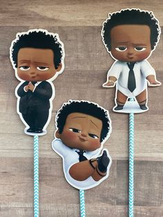 three stickers depicting two black men in suits and ties, one is holding a microphone