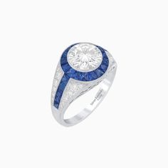 Indulge in the timeless allure of this antique-inspired ring, meticulously crafted to perfection with a round lab grown diamond on its center. The ring showcases an exquisite display of elegance with its hand-set pavé diamonds and channel-set French cut blue sapphires, creating a harmonious blend of sparkle and color. The intricate hand milgrain detailing adds a touch of vintage charm, while the spotless polishing enhances its radiant glow. Experience the luxury of fine craftsmanship and impeccable design with this remarkable piece. Let this mesmerizing ring become a symbol of your unique style and sophisticated taste. Elevate your jewelry collection with this captivating treasure that exudes remarkable style and timeless beauty.  It is crafted by hand and  is customizable with any stone a Antique Inspired Engagement Rings, French Cut, Ruby Emerald, Ring With Diamond, Antique Inspiration, Channel Set, Pink Sapphire, Pave Diamonds, Vintage Charms