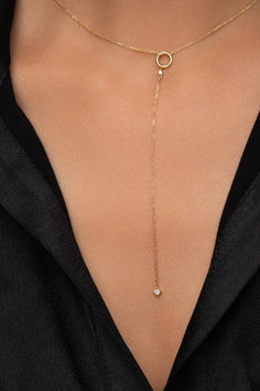 Introducing your next everyday favorite: a Circle Lariat Y Necklace with Diamonds. Featuring a 10cm chain and two round-cut diamonds in a modern lariat design, this 14k gold necklace is destined to take center stage in all your V-neck outfits and win the game of impressions! Minimalist 14k Yellow Gold Lariat Necklace, Diamond Lariat Necklace With Delicate Chain, Fine Jewelry Lariat Necklace With Dangle Feature, Fine Jewelry Lariat Necklace With Adjustable Chain, Delicate Diamond Lariat Necklace With Adjustable Chain, Delicate Lariat Diamond Necklace With Adjustable Chain, Gold Diamond Long Drop Necklace, Everyday Luxury Yellow Gold Lariat Jewelry, Fine Jewelry Lariat Drop Necklace With Delicate Chain