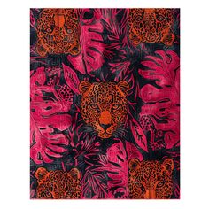 an orange and pink leopard print on black fabric with red, purple, and green leaves