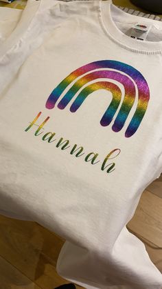 Personalised rainbow T-shirt  Can change the font of the name also  Sizes newborn up to age 7-8years available Have shown other designs I do as can tailor make customer T-shirt's for birthdays/announcements or any occasions Rainbow Birthday Shirt, Newborn Baby Onesies, Rainbow Bodysuit, Cricut Birthday, Vinyl Personalized, Rainbow T Shirt, Rainbow Outfit, Birthday Girl Outfit, Rainbow Gift