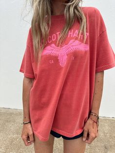 Our favorite tee of the season! Runs true to size. Size up if you want an oversized fit like photos. Laura is 5’4” tall and wearing a Large Oversized Sporty T-shirt For Fall, Sporty Graphic Print T-shirt For Day Out, Oversized Soft-washed T-shirt For Fall, Oversized Relaxed T-shirt For Fall, Oversized Text Print T-shirt For Day Out, Oversized Graphic Tee For Day Out, Oversized Pink T-shirt For Day Out, Oversized Urban Red Top, Urban Oversized T-shirt For Fall