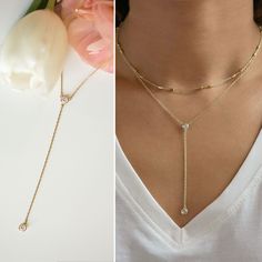 Lariat Necklace, Dainty Necklace, Layer Necklace, Y Necklace, MEASUREMENTS & MATERIALS - .925 Sterling Silver / 14K Gold Vermeil / 14K Rose Gold Vermeil - Cubic Zirconia Crystals - Pendant Height 2 1/2 in | 6.3 cm - Chain 18 in | 45.7 cm - Hypoallergenic, lead & nickel free - Handcrafted in NYC COMPLETE THE LOOK: - Crystal Choker N062: https://www.etsy.com/listing/484350920/ - Love Knot Necklace N316: https://www.etsy.com/listing/600399896/ To shop more Y Lariat Necklaces: https://www.et Minimalist Lariat Necklace With Clavicle Chain For Layering, Minimalist Adjustable Layered Clavicle Necklace, Minimalist Layered Necklace With Adjustable Delicate Chain, Minimalist Layered Necklace With Adjustable Chain, Minimalist Adjustable Layered Necklace For Everyday, Adjustable Long Layered Minimalist Necklace, Minimalist Long Adjustable Layered Necklace, Minimalist Adjustable Long Layered Necklace, Minimalist Double Strand Lariat Necklace With Adjustable Chain