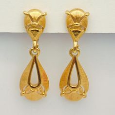 Unique and fun vintage Trifari earrings are in beautiful textured and polished metal.  These are abstract, however, I see an animal.  I see two tiny ears and a small nose, a curved down frown mouth and triangle chin.  On the dangle I see an open tummry area, two legs with two tiny feet.  The ears, nose and feet elements are the same.  I could be totally wrong as most people disagree with my vision.  So you can decide for yourself.  These have clip on backs and measure 1 3/4 inches long.  Signed Gold Teardrop Earrings With Artistic Design, Vintage Dangle Earrings With Artistic Design, Metal Dangle Earrings With Artistic Design, Artistic Design Metal Dangle Earrings, Gold Drop Earrings With Artistic Design, Sweetheart Jewelry, Small Nose, Cobalt Blue Earrings, Sister Jewelry