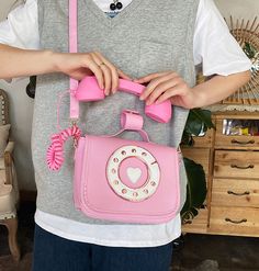 Cute Telephone Shoulder Bag PN4876 ●Size: Bigger one: 23*20*11 cm; Smaller one: 20*16*10 cm ●Material :pu ●Note:Only comes with the bag. (Please allow 1-3cm differs due to manual measurement.As different computers display colors differently,the color of the actual may vary slightly from the above images.Thanks for your understanding.) ●About Shipping: We attach great importance to the orders of each customer and parcel delivery. 1.Processing time: 2-3 business days. 2.Shipping time: 10-15 business days to US, please allow 3-4 weeks shipping to other country.(Shipping times can be affected by variable customs clearance times or public holidays.) Pink Retro Shoulder Bag With Adjustable Strap, Retro Pink Shoulder Bag With Adjustable Strap, Retro Pink Shoulder Bag For Daily Use, Pink Retro Satchel Shoulder Bag, Retro Pink Satchel Shoulder Bag, Pink Retro Handheld Shoulder Bag, Pink Satchel Shoulder Bag With Single Strap, Pink Crossbody Shoulder Bag With Single Handle, Pink Single Handle Crossbody Shoulder Bag