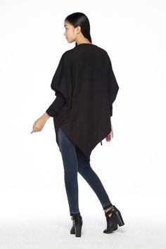 "🚚..ALL ORDERS ARE SHIPPED VIA DHL EXPRESS MAIL This batwing tunic is a very \"cool\" addition to any wardrobe! With a unique drawstrings on bottom hem of tunic provide plenty of options for changing the look. Cowl neckline, batwing sleeves with wide cuffed and oversized side pocket; can be worn layered over leggings, pants, or skirt for even more dramatic effects. * Pull-on style * Cowl neckline * Dropped shoulders * Long sleeves with wide ribbed cuff * Oversize side pocket * Asymmetrical hem Winter Plain Top With Asymmetrical Hem, Winter Workwear Top With Asymmetrical Hem, Long Sleeve Cape For Fall Workwear, Casual Long Sleeve Cape For Layering, Asymmetrical Sweater For Winter, Chic Long Sleeve Cape For Fall, Casual Long Sleeve Cape For Fall, Solid Poncho For Winter Layering, Oversized Winter Top With Asymmetrical Hem