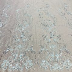 Embroidered & Beaded Net Mesh Fabric with Beads. Lace USA Elegant Silver Sequin Fabric With Floral Embroidery, Elegant Wedding Sequin Fabric With Resham Embroidery, Elegant Embroidered Fabric For Mother Of The Bride, Elegant Sequin Fabric With Floral Embroidery For Reception, Elegant Cream Embroidered Fabric With Sequins, Elegant Silver Floral Embroidered Fabric, Elegant Embroidered Tulle Fabric For Ceremony, Elegant Embroidered Fabric For Ceremony, Elegant Silver Embroidered Fabric For Wedding