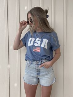 USA T-Shirt / Light Blue / Fourth of July shirt https://etsy.me/2SSfg76 #blueusashirt #usaflagshirt #patriotictshirt #memorialdayshirt #usatshirt #americatshirt #fourthofjulyshirt #americashirt #july4th #redwhiteblue Casual Blue Tops With American Flag Print, Trendy Blue Pre-shrunk T-shirt, Relaxed Fit Summer Tops Made In Usa, Summer Crew Neck Tops Made In Usa, Blue American Flag Print Short Sleeve Top, Casual Summer Shirt Made In Usa, Casual Relaxed Fit Tops For 4th Of July, Blue Short Sleeve Top With American Flag Print, Casual Cotton Tops For 4th Of July