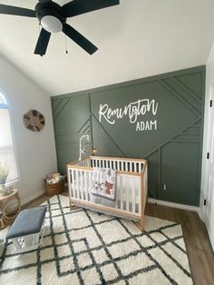 a baby's room with green walls and white carpet