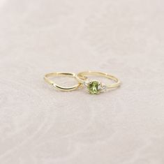 14k Peridot Diamond Ring Set | 5.0MM Natural Peridot Ring Set | Peridot Engagement Ring Set | August Birthstone | 14k Peridot Ring Set | Handmade Jewelry P R O D U C T 𝄪 D E T A I L S ENGAGEMENT RING:  ✽ Metal: 14k Yellow Gold, White Gold & Rose Gold ✽ Bottom Band Width: 1.5 MM ✽ Stone Size: Natural Peridot 5.0 MM x 1pc (approx. 0.5ct) / Natural Diamond 2.3 MM x 2pcs (approx. 0.10ct) ✽ Diamond Color: G ✽ Diamond Clarity: VS2-SI1 ✽ Made to Order WEDDING BAND:  ✽ Metal: 14k Yellow Gold, White Gol Peridot Engagement Rings Gold, Peridot Engagement Ring, Rose Gold Top, Peridot Engagement Rings, Diamond Ring Set, Band Metal, August Birthstone, Diamond Ring Settings, Peridot Ring