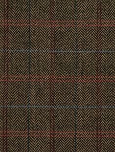 a brown and black plaid fabric with red, blue, and green lines on it