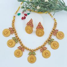 Experience the divine elegance with our 18-Inch Laxmi Temple Necklace, meticulously crafted to capture the spiritual essence and opulence of a temple. This necklace pays homage to Goddess Laxmi and the cultural significance she represents. It's not only a piece of jewelry but a symbol of devotion and spirituality. Materials: Temple Design: The necklace features intricate temple-inspired design elements, showcasing the rich heritage of Indian craftsmanship and devotion. Design: The necklace boast Multicolor Temple Jewelry Necklace, Temple Jewelry With Round Motifs, Round Temple Jewelry With Motifs, Festive Multicolor Temple Jewelry Bridal Sets, Gold Bridal Necklace With Motifs For Festivals, Diwali Temple Jewelry Bridal Sets, Temple Jewelry Bridal Sets For Diwali, Bollywood Style Round Temple Necklace For Festivals, Temple Jewelry Bridal Sets For Diwali Celebration